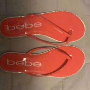 Bebe Ileana flip flop. NWOT.  Coral, size 8
